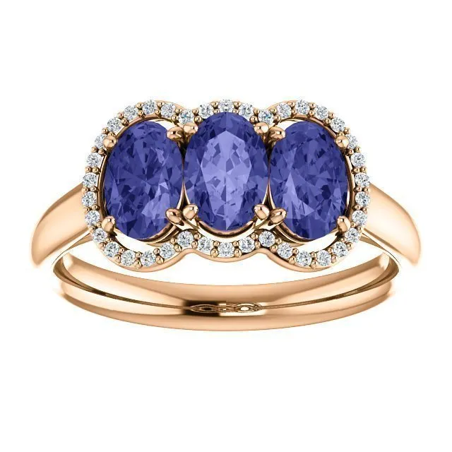 14KT GOLD 1.50 CTW TANZANITE & .10 CTW DIAMOND 3 STONE OVAL HALO RING