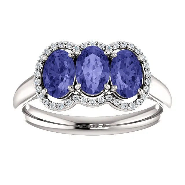 14KT GOLD 1.50 CTW TANZANITE & .10 CTW DIAMOND 3 STONE OVAL HALO RING