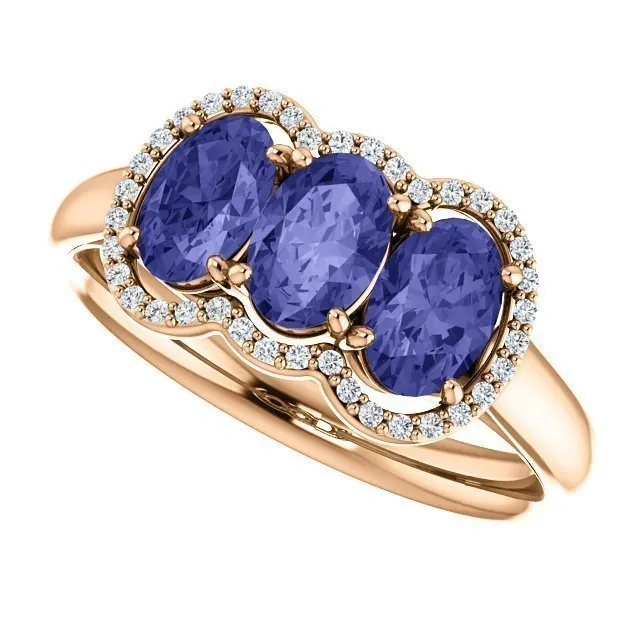 14KT GOLD 1.50 CTW TANZANITE & .10 CTW DIAMOND 3 STONE OVAL HALO RING