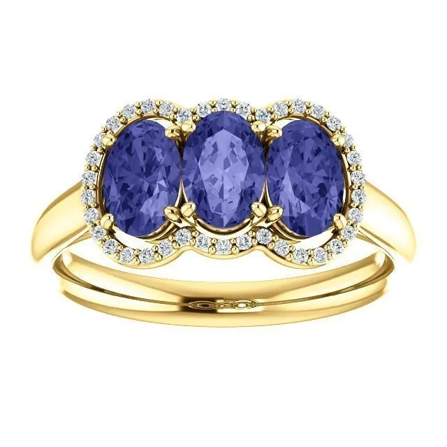 14KT GOLD 1.50 CTW TANZANITE & .10 CTW DIAMOND 3 STONE OVAL HALO RING